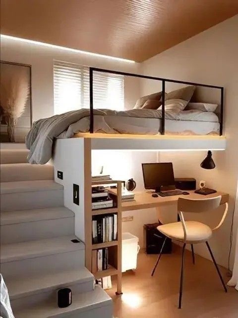 Modern loft bed and home office interior in Indore featuring a raised bed, built-in staircase, and workspace underneath.