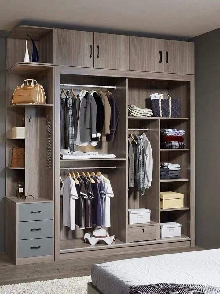 Modern wood wardrobe in Indore featuring sliding doors, side open shelves, drawers, and hanging storage.